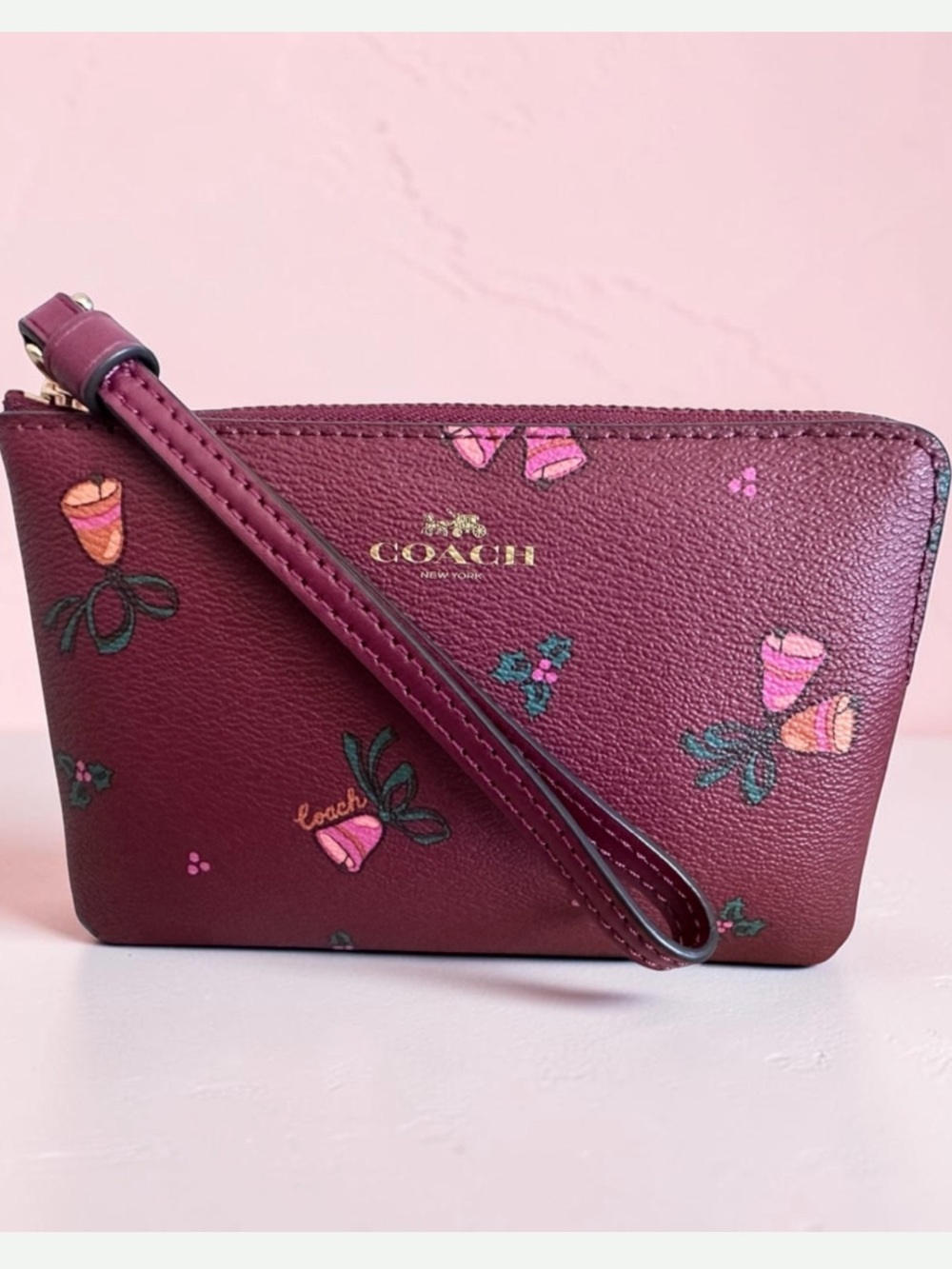 COACH Burgundy holiday bells Wristlet with Gold Logo nwt